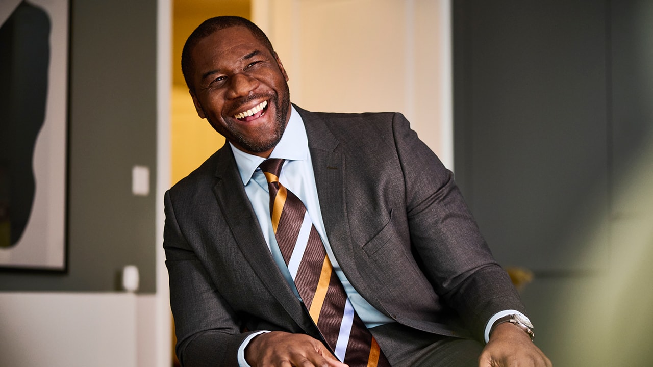 Man in suit laughing